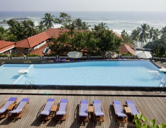 infinity pool at Gokulam Grand Turtle on the beach