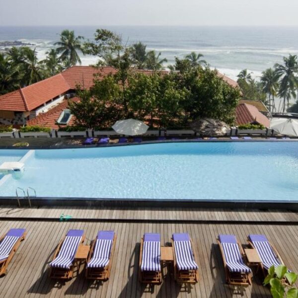 infinity pool at Gokulam Grand Turtle on the beach