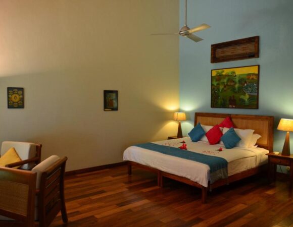 bedroom of Pool View cottage in Neeleshwar hermitage resort